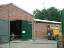 Rob Linton sets up broadcasting equipment in new building